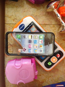 My daughter prefers her fake iPhone over her other phone toys, and has tried to eat the paper screen.