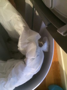 The knot securing the  Glad trash bag in our Diaper Dekor.